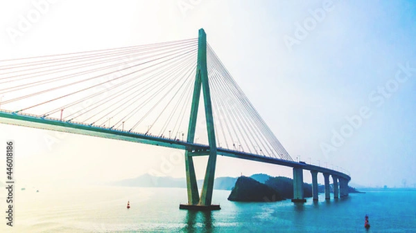 Fototapeta MOKPO, KOREA, SOUTH - Apr 02, 2016: Mokpo Bridge over the sea under the sunlight and a blue sky in South Korea