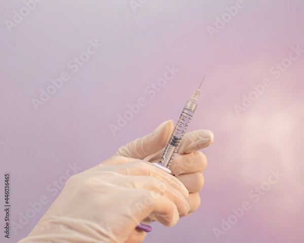Fototapeta Vaccination concept  background with copy space
. Lipotropic injections close up. Woman Belly fat dissolving treatment. Body lifting injections syringe close up.