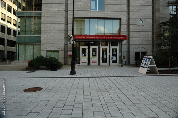 Fototapeta Montreal, QC, Canada - 7-14-2021: Desautels Faculty of management McTavish street at McGill University at summer day after the ease of the lockdown of coronavirus and Montreal became in the Green Zone