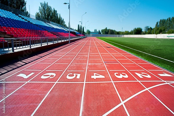 Obraz Czerwony bieżnia na stadionie