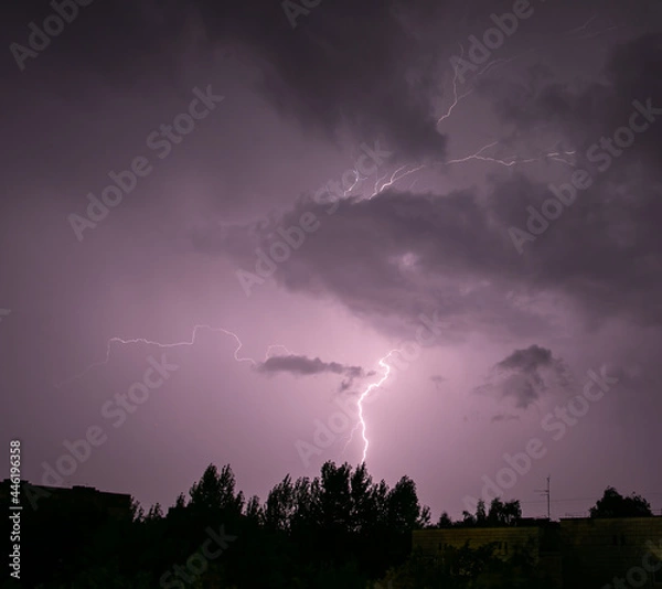 Fototapeta Lightning during a storm over the city in the nightLightning during a storm over the city in the night