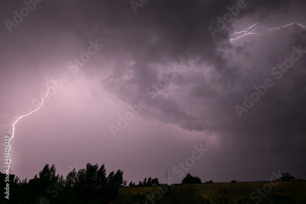 Fototapeta Lightning during a storm over the city in the nightLightning during a storm over the city in the night