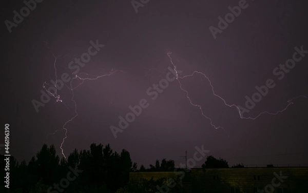 Fototapeta Lightning during a storm over the city in the nightLightning during a storm over the city in the night