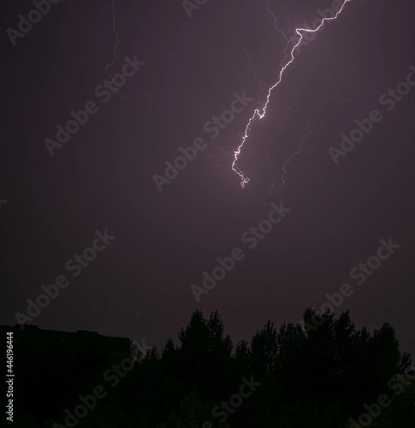 Fototapeta Lightning during a storm over the city in the nightLightning during a storm over the city in the night