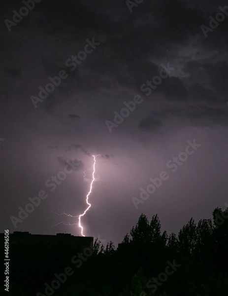 Fototapeta Lightning during a storm over the city in the nightLightning during a storm over the city in the night