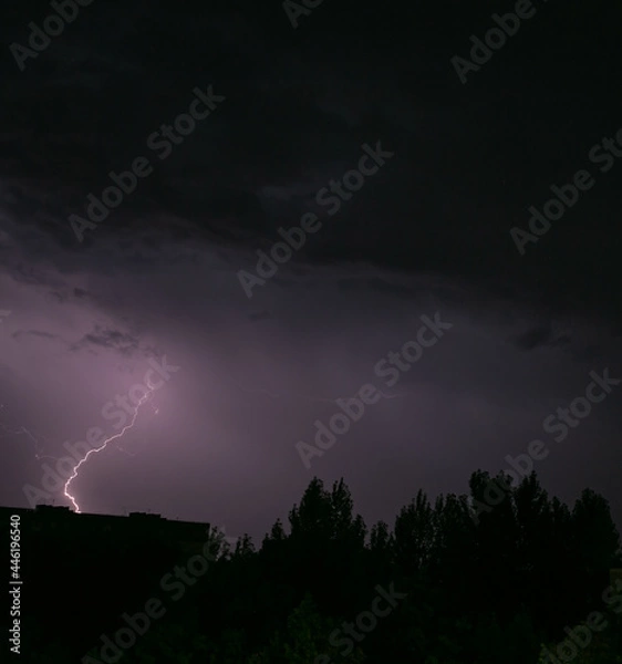 Fototapeta Lightning during a storm over the city in the nightLightning during a storm over the city in the night