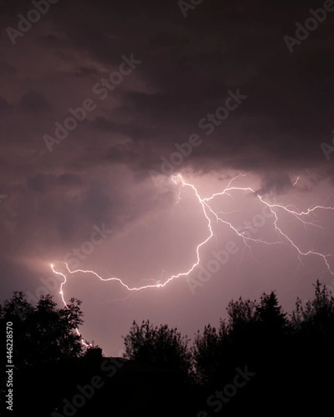 Obraz Lightning strike captured on night sky.