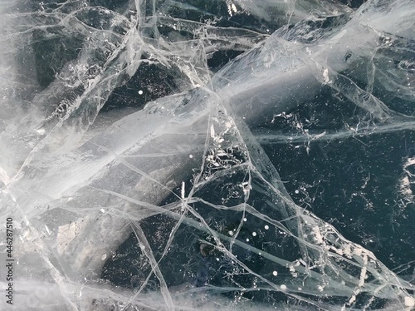 Obraz transparent ice with bubbles and cracks