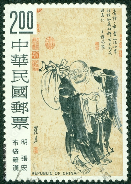 Fototapeta stamp printed in Taiwan shows a monk with a bag