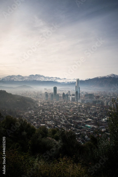 Fototapeta A view of Santiago, Chile, from the mountains, with the snowy mountains behind