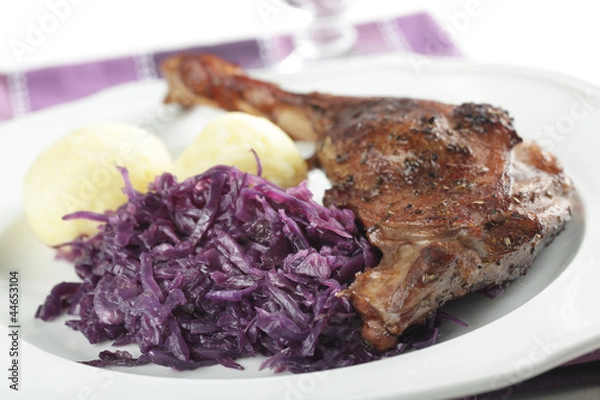 Fototapeta Roasted goose leg with vegetables