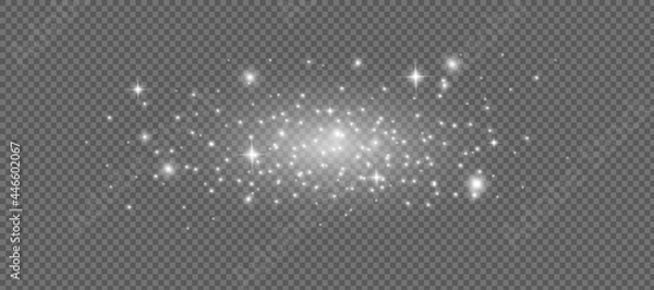 Fototapeta The dust sparks and golden stars shine with special light. Vector sparkles on a transparent background. Christmas light effect.
