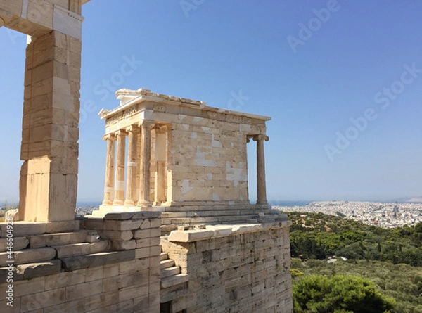 Fototapeta The Temple of Athena Nike is a temple on the Acropolis of Athens, dedicated to the goddesses Athena and Nike. It has a prominent position on a steep bastion to the right of the entrance, the Propylaea