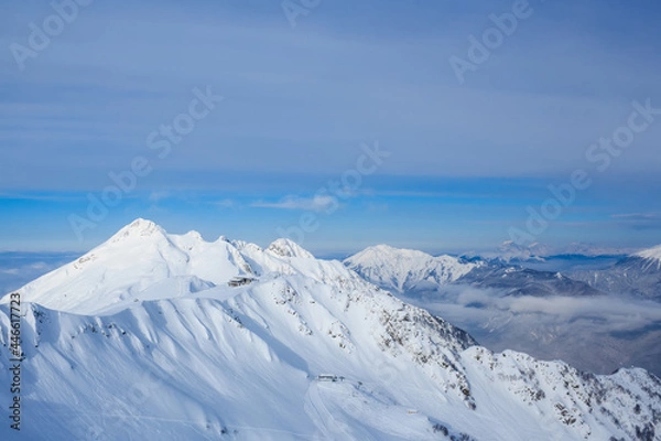 Fototapeta building on the top of mountains covered with snow in sochi Rosa Khutor ski resort