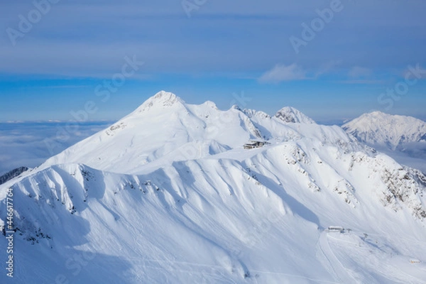 Fototapeta lodge in mountain covered with snow in mountain ski resort Rosa Khutor Sochi