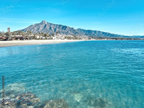 Fototapeta Marbella beach with blue sky and the shell behind. La Concha is the most famous mountain in Marbella