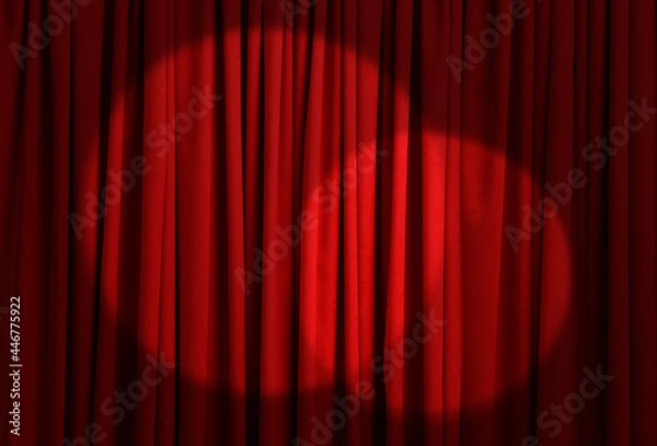 Fototapeta Spotlights illuminating closed red stage curtains. Start of performance