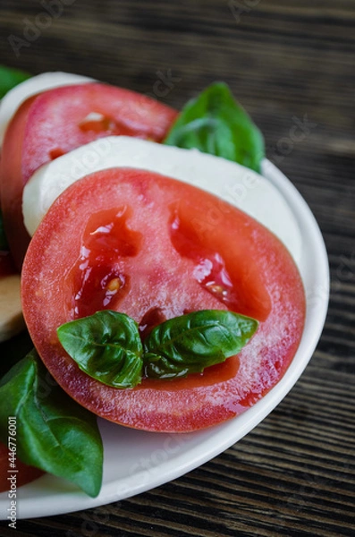 Fototapeta Italian salad with mozzarella cheese and tomato
