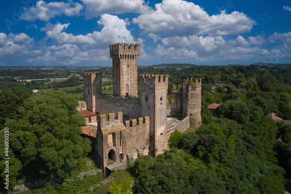 Fototapeta Castle Scaligero in Valeggio sul Mincio, Italy. Aerial panorama of the Scaligero castle, Verona. Aerial view of the Italian historic castle Castello Scaligero on a hill.