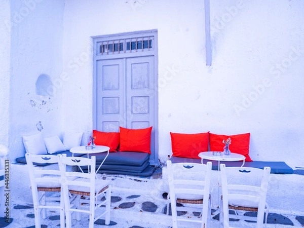 Obraz table and chairs with red cushions