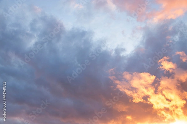 Fototapeta Colorful sky background: dreamy and moody blue, purple and yellow cloudy sunset or sunrise