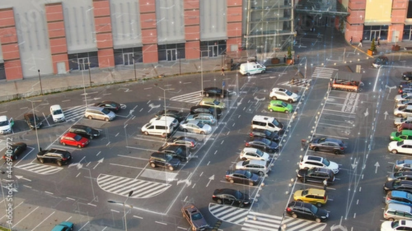 Obraz Aerial view of city parking lot with 3D graphic holographic lines on vacant places. Traveling navigation app online. Transport application.