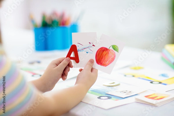 Fototapeta Kid learning to read. Phonics flash cards.
