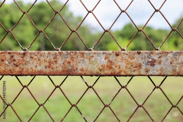 Fototapeta old rusty metal mesh fence outdoor,abstract background