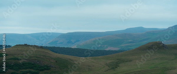 Obraz a large green field with a mountain in the background