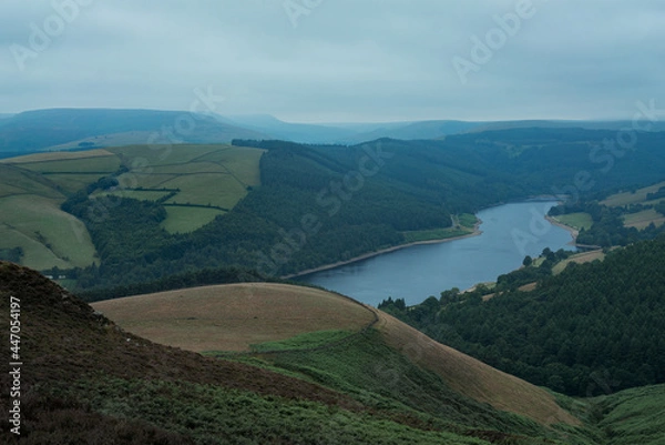 Obraz a view of a ladybower reservoir in the Peak District UK a large body of water with a mountain in the background