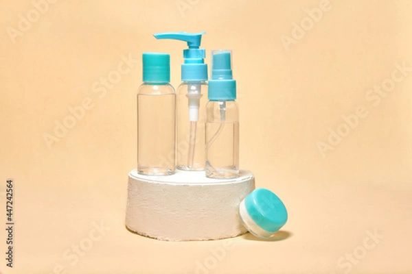Fototapeta Cosmetics container on the pastel background. Earth colors, zero waste containers. Mockup concept. Minimal boxes and geometric podium. Scene with geometrical forms. 