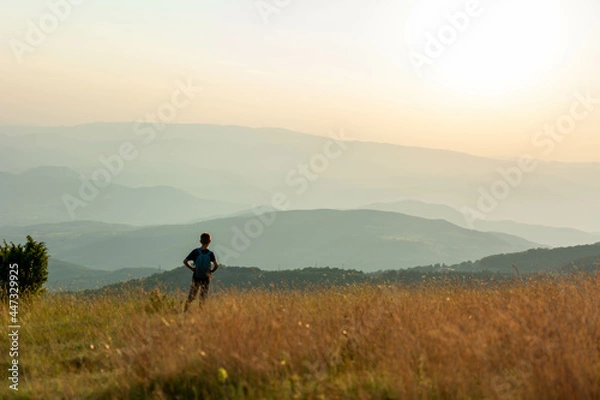 Obraz Boy hike in beautiful nature with sunset.