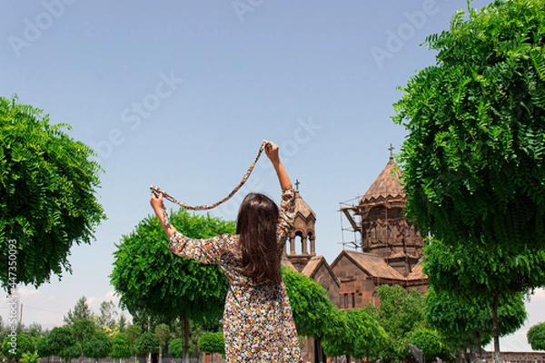Obraz A girls scarf is playing with the wind