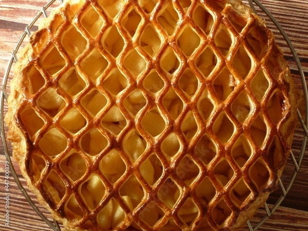 Obraz Apple pie decorated with a lace puff pastry