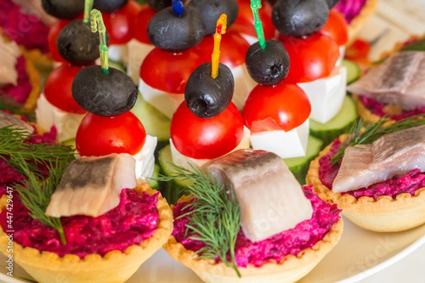 Fototapeta appetizer on the festive table on skewers and in tartlets