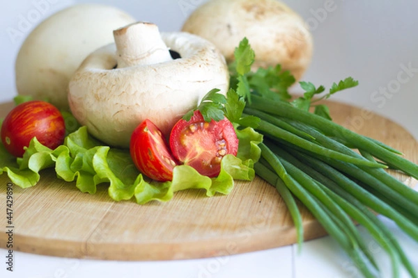 Fototapeta cooked champignons with tomatoes and herbs