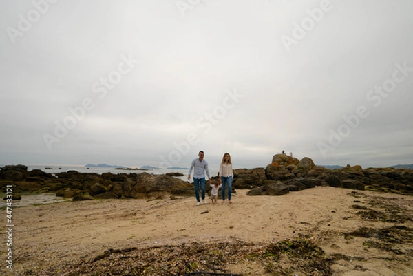 Fototapeta Parent and child in the beach