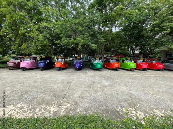 Obraz Many colorful taxi tuk tuks are lined up waiting to serve the journey.