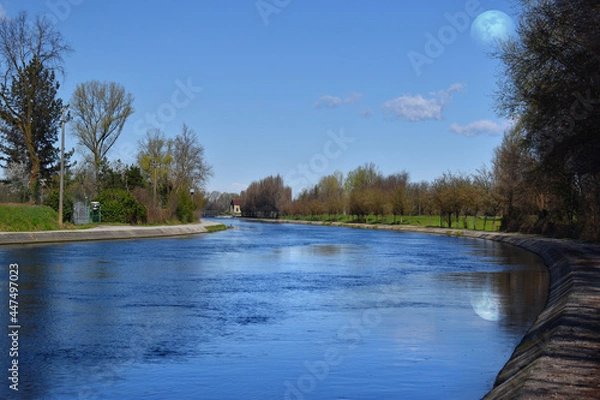 Fototapeta wonderful spring day with magic moon in the blue sky
