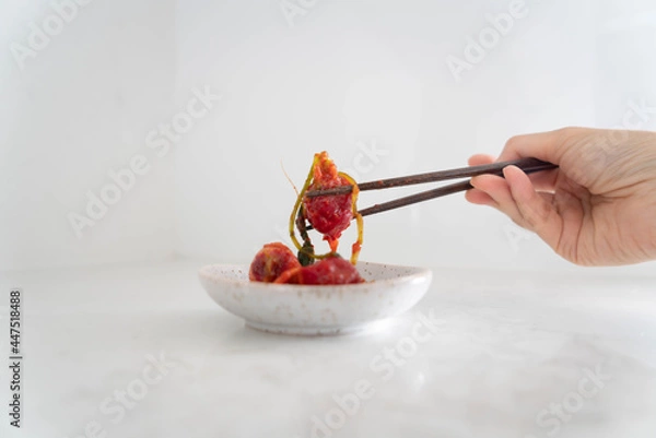 Fototapeta person holding a kimchi