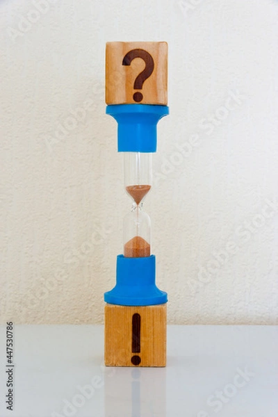 Fototapeta Cubes and hourglass - the question flows into the answer, answer comes over time.