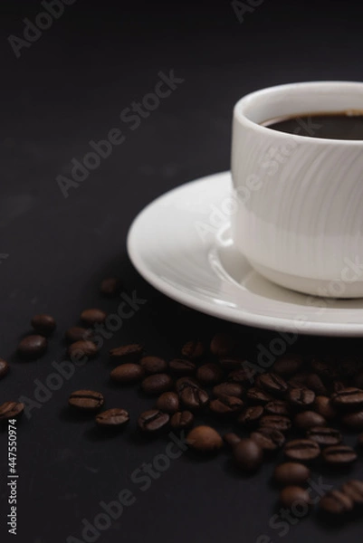 Obraz White coffee mug with spoon on coffee background