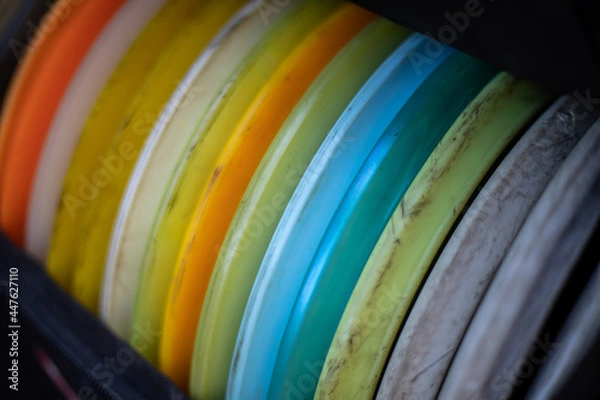 Fototapeta Many disc golf discs in the bag.