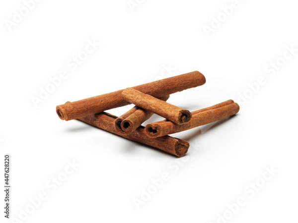 Fototapeta cinnamon sticks isolated on white