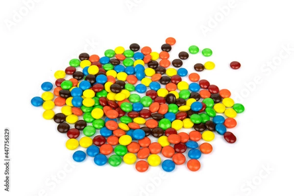 Fototapeta Colorful chocolate in and out of focus on white background.