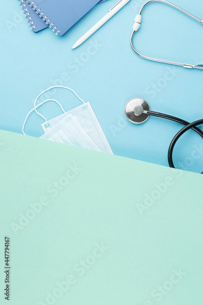 Obraz Stethoscope with notepad on the nurse desk.