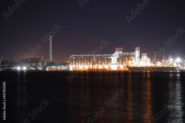Fototapeta View of illuminated harbor at night