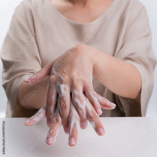 Obraz Hand washing on white background medical procedure concept