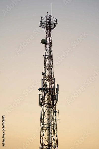 Obraz Communications tower with sunset sky background 