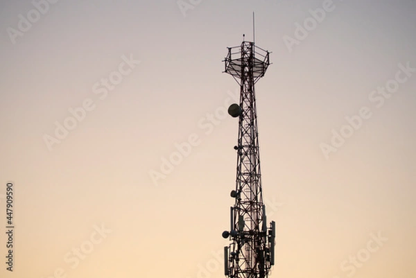 Obraz Communications tower with sunset sky background 